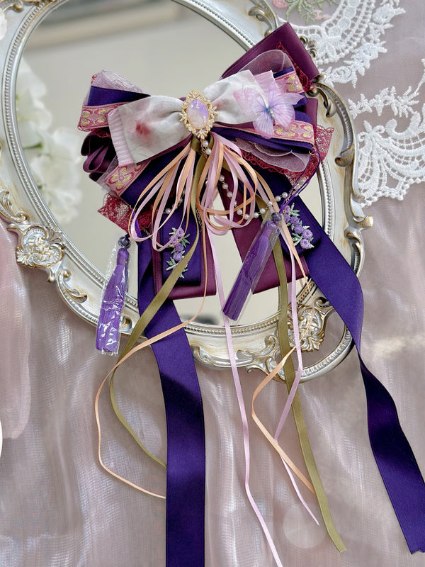 Fancy purple romantic bow flower streamers